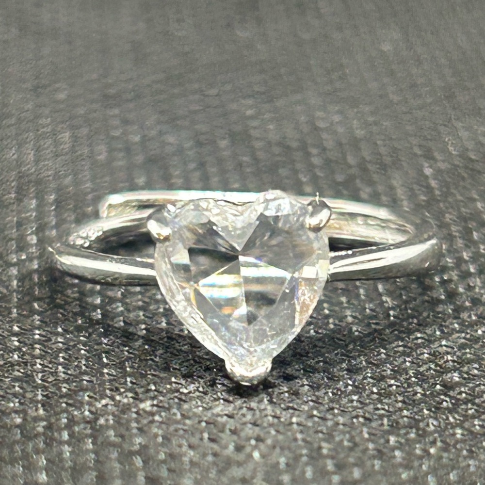 Adjustable stamped sterling silver ring with a heart-cut lab-created diamond